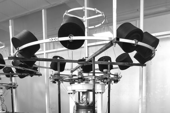 a machine with fabric at the top of it