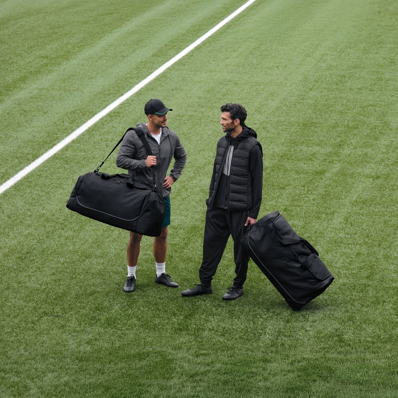 QS88 Teamwear XL Holdall Updated Design + QS87 Teamwear Wheeled Holdall - Black/Grey (Lifestyle shot)